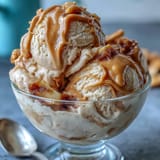 Golden swirls of 4-Ingredient Peanut Butter Banana Ice Cream ready to scoop.